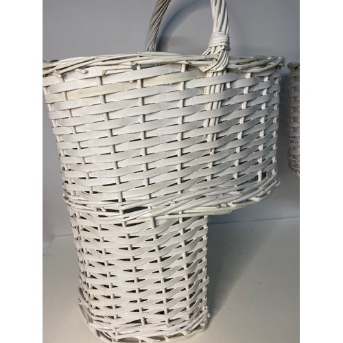 206 - 2 x white wicker step baskets measuring 52 cms tall and 1 vintage basket.