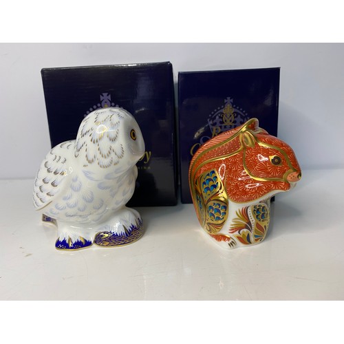 267 - Two boxed Royal Crown Derby Paperweights in new condition with gold stoppers to base of both pieces.... 