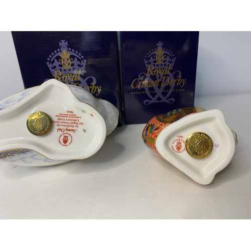 267 - Two boxed Royal Crown Derby Paperweights in new condition with gold stoppers to base of both pieces.... 