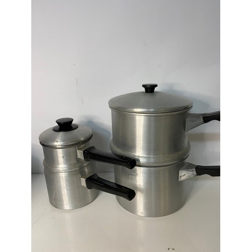 285 - Selection of vintage aluminium pans and steamers.