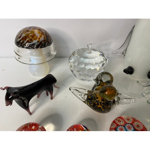 326 - Selection of glass paperweights and glass animals, including large penguin.