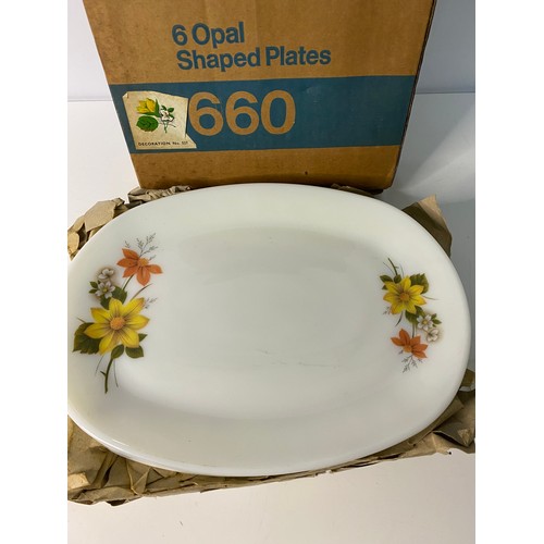 328 - Set of 6 as new in original box, Pyrex oval shaped plates.  White with flower decoration.