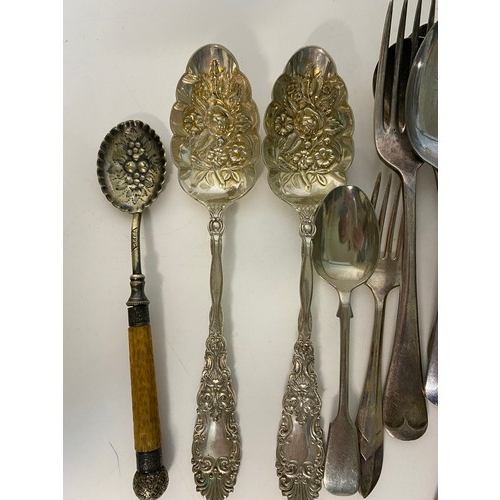 124 - Selection of old cutlery including fish knives and forks, spoons and decorative spoons.