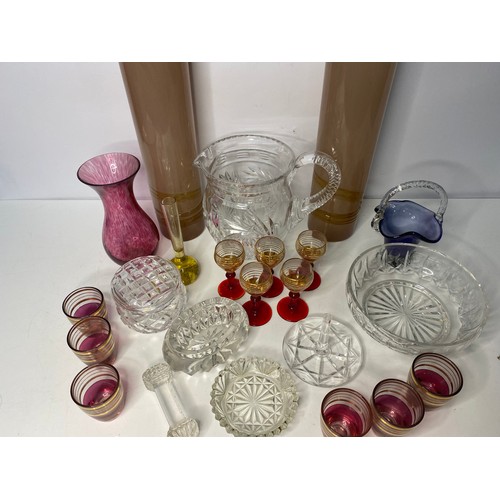 90 - Assortment of coloured glassware and vases.