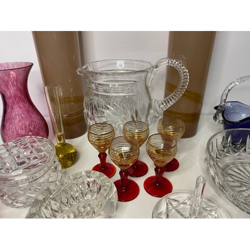 90 - Assortment of coloured glassware and vases.