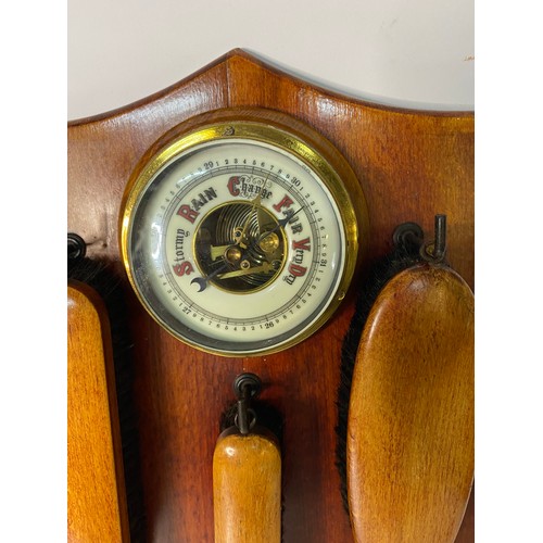 302 - 1950's wooden wall barometer with clothes brush.