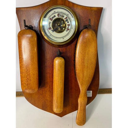 302 - 1950's wooden wall barometer with clothes brush.