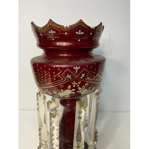 317 - A Victorian Cranberry glass Lustre measuring 33 cms tall