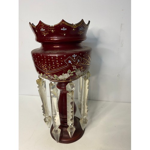 317 - A Victorian Cranberry glass Lustre measuring 33 cms tall