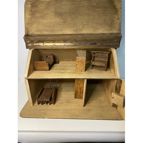 355 - Vintage wooden dolls house with furniture measuring 52 x 40 cms tall