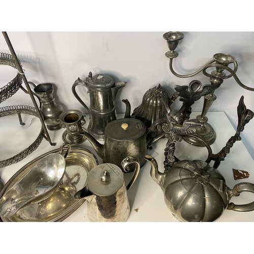 399 - Selection of metal ware including teapots, cake stands and candleabra.