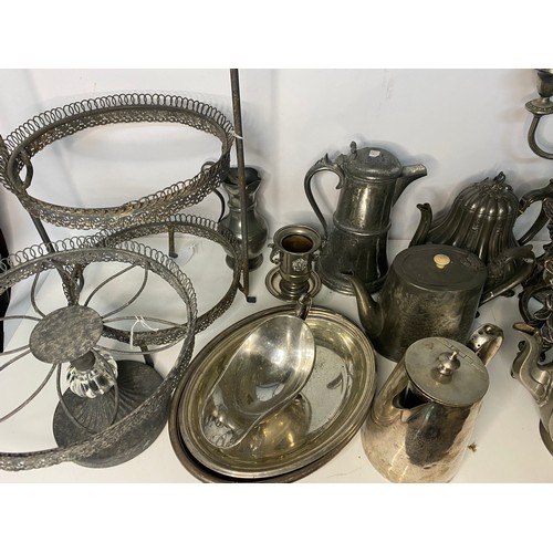 399 - Selection of metal ware including teapots, cake stands and candleabra.