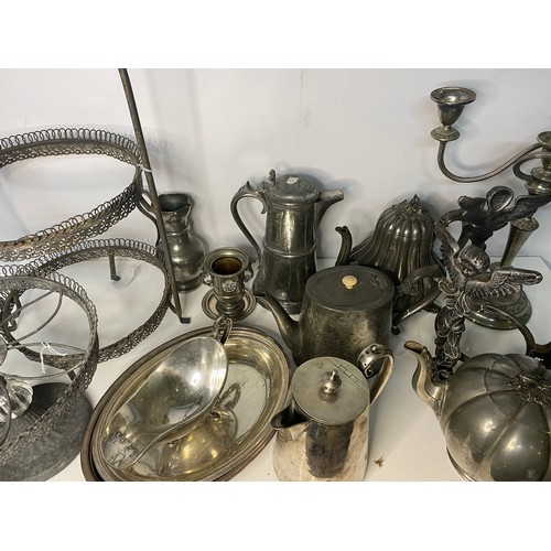 399 - Selection of metal ware including teapots, cake stands and candleabra.