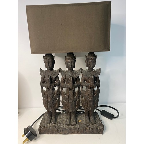 401 - Wooden lamp depicting 3 Buddha figures with brown shade measuring 46 cms tall  and gold tone metal l... 