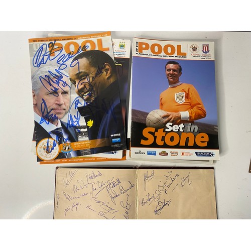 427 - Selection of autographed pictures, programmes and an autograph book