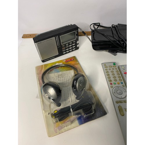 126 - Selection of electrical items including radios, remotes, headphones and cables.