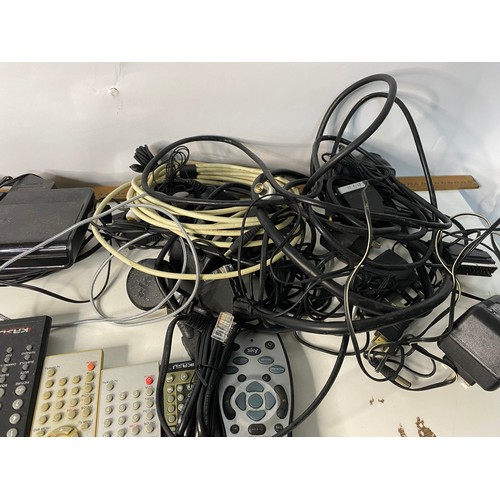 126 - Selection of electrical items including radios, remotes, headphones and cables.