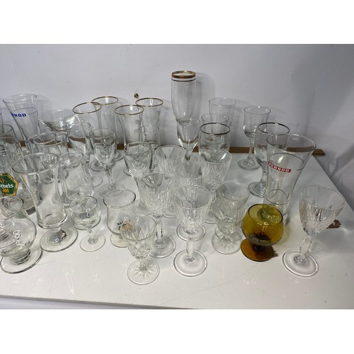 199 - Large selection of advertising glasses including cocktail glasses, tumblers and others.