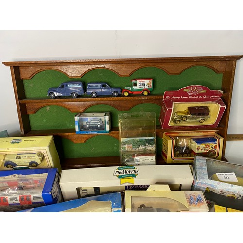 331 - 15 x Die Cast models mainly boxed and model car display shelf measuring 54x27cms.