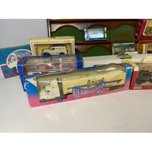 331 - 15 x Die Cast models mainly boxed and model car display shelf measuring 54x27cms.