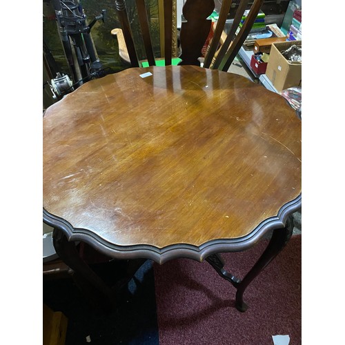 357 - Edwardian Mahogany shaped circular window table measuring 74 cms diameter