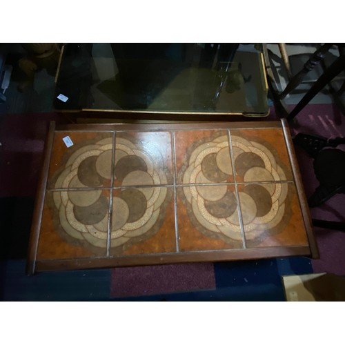 388 - Mid century coffee table with tile top and teak legs measuring 48 x 86 x 40 cms tall