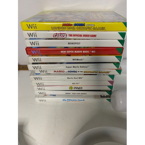 410 - Nintendo Wii console and Wii Fit, Sports Bundle, MarioKart, lots of accessories and 12 games. Small ... 