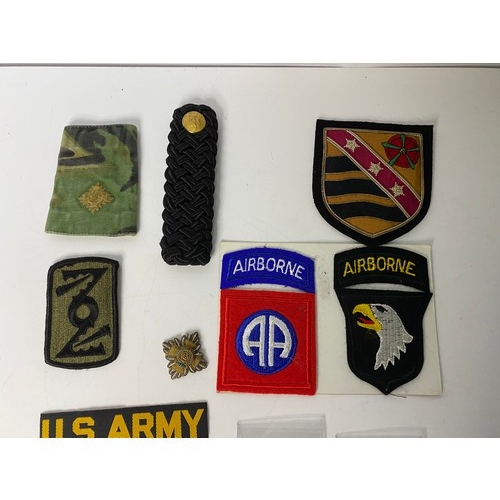 14 - Bag of military medals, badges and patches.