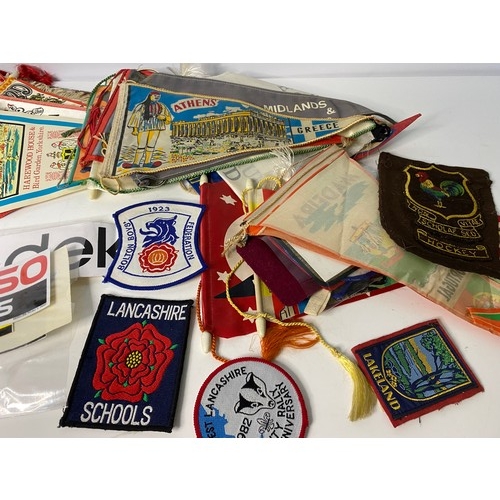 43 - Large collection of pennants, badges and stickers.