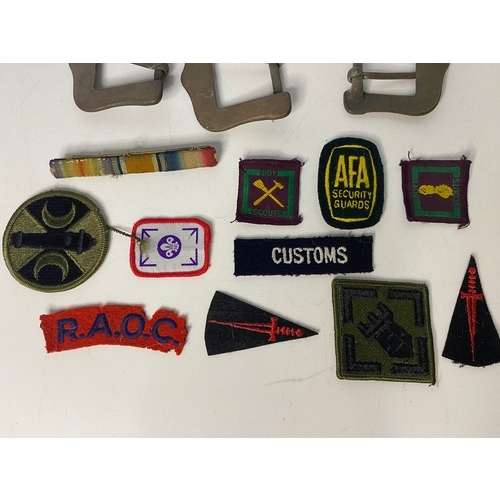 56 - Collection of military brass belt buckles including Cheshire Volunteers and military patches