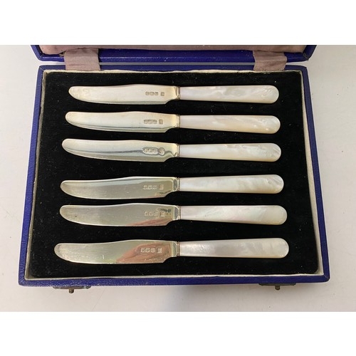 416 - A vintage set of hallmarked silver and mother of pearl tea knives