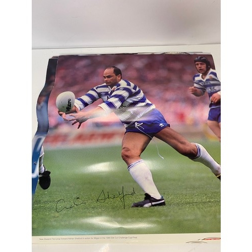 427 - Selection of autographed pictures, programmes and an autograph book