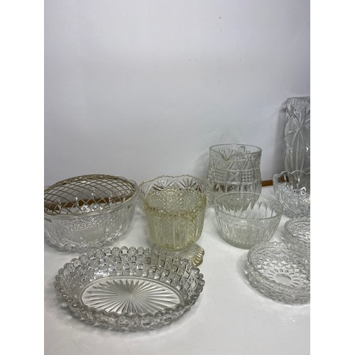 672 - Selection of glass dishes, jugs, vases and bell.