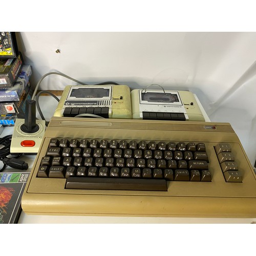 633 - A vintage Commodore 64 with selection of games and monitor