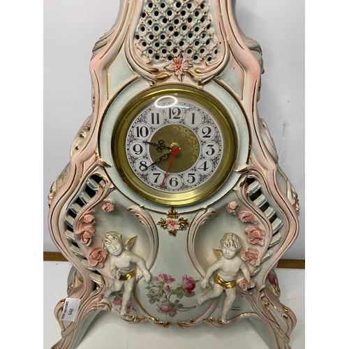 648 - Large ornate porcelain table clock measuring 63 cms tall