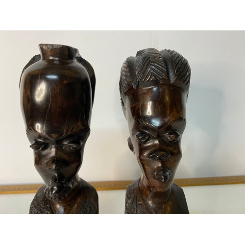 701 - Pair of hand carved African Tribal busts measuring  22 cms tall