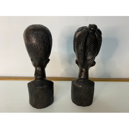 701 - Pair of hand carved African Tribal busts measuring  22 cms tall