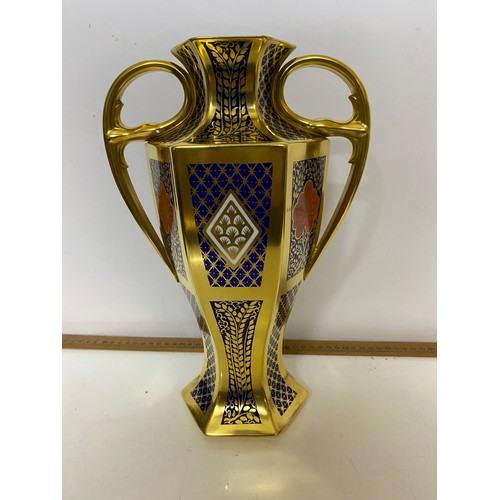 766 - A Caverswall 'Romany' pattern 2 handled urn with lid measuring 42 cms tall