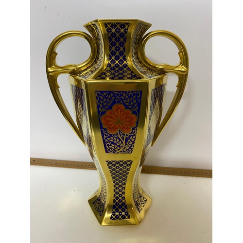 766 - A Caverswall 'Romany' pattern 2 handled urn with lid measuring 42 cms tall