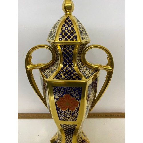 766 - A Caverswall 'Romany' pattern 2 handled urn with lid measuring 42 cms tall