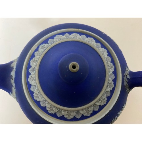 772 - Black Wedgwood table lighter and dark blue Wedgwood teapot, slight chip to rim