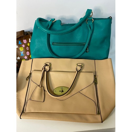 734 - Quantity of designer style handbags.