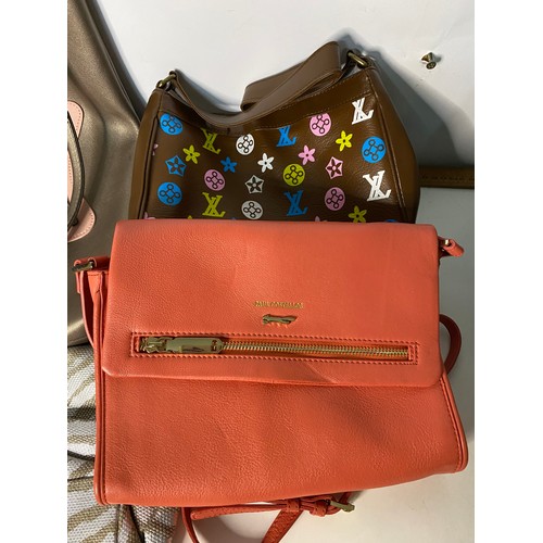 734 - Quantity of designer style handbags.