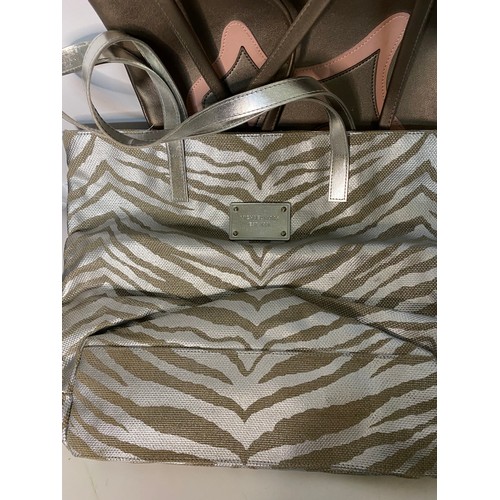 734 - Quantity of designer style handbags.