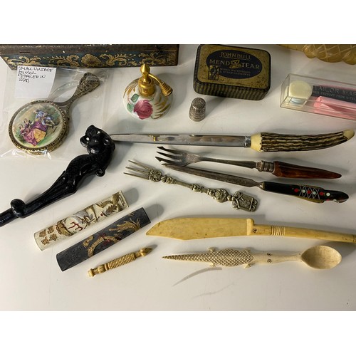 793 - Box of curios including pickle fork, tins and a model hand.