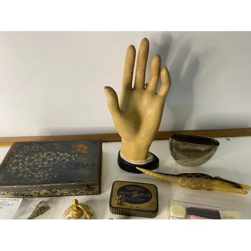 793 - Box of curios including pickle fork, tins and a model hand.