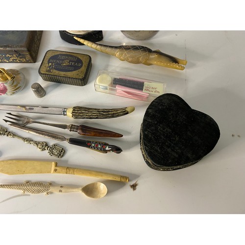 793 - Box of curios including pickle fork, tins and a model hand.