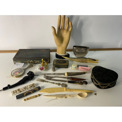 793 - Box of curios including pickle fork, tins and a model hand.