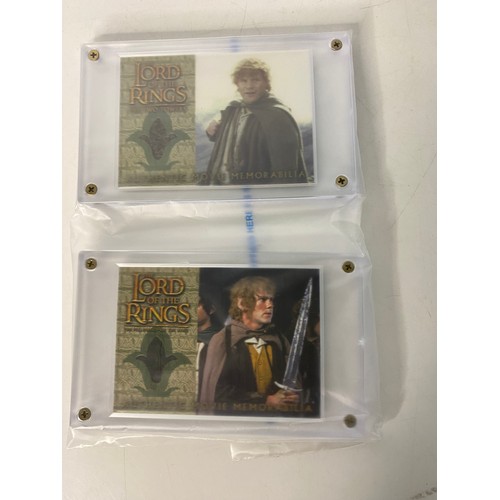 808 - Topps Lord of the Rings, two authentic movie memorabilia costume cards in archival safe card holder ... 