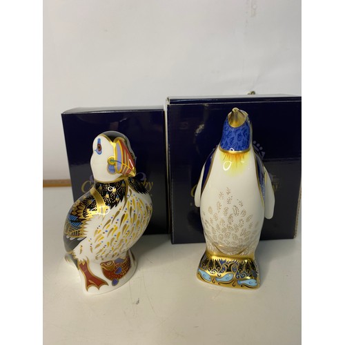 812 - Two boxed Royal Crown Derby paperweights in as new condition with gold stoppers to base of each. The... 